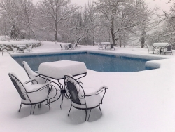 The pool surrounded by snow